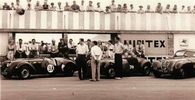 Dudley Hely standing by the Healey